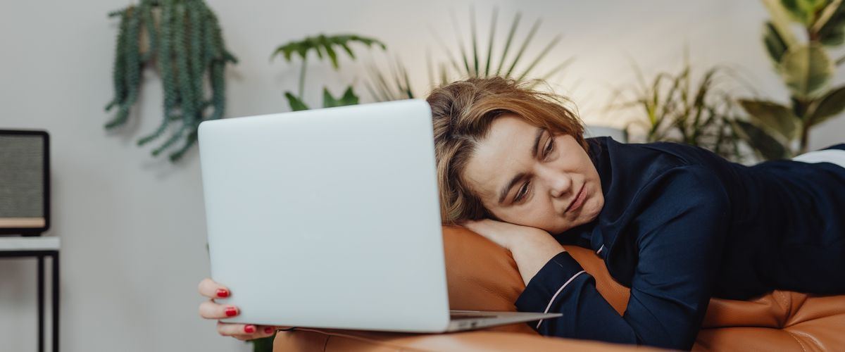 An exhausted family caregiver taking a moment to rest