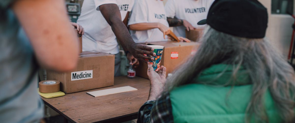Volunteers helping at a charity home for the elderly