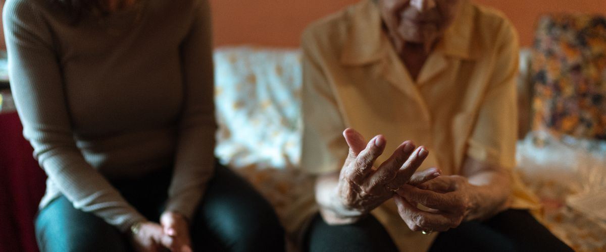 A family visiting a care home before deciding