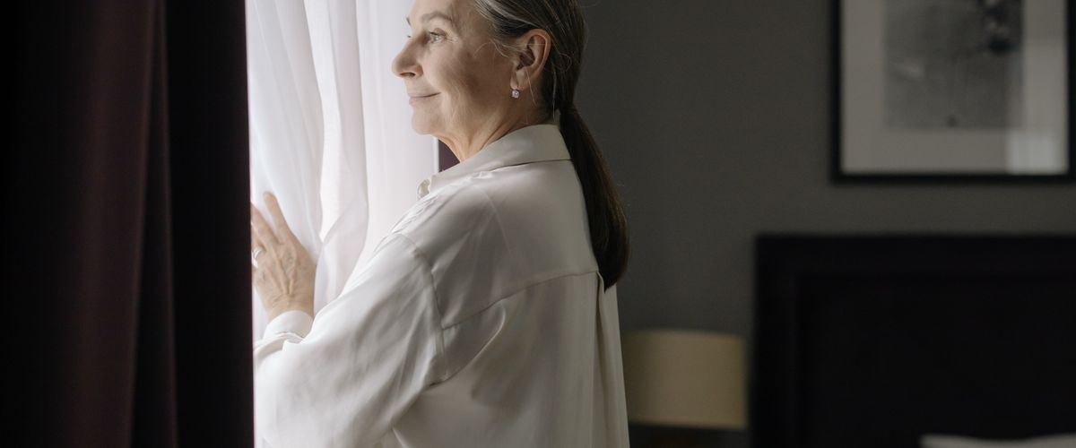 An elderly woman alone at home, where the first signs of needing help appear