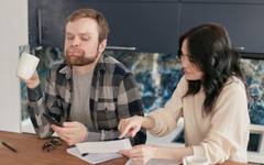 A family reviewing care costs together at the kitchen table