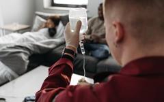 A bedridden patient being cared for at home