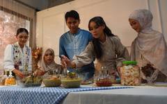 A Malaysian family sharing a meal across generations