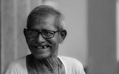 An elderly Malaysian man, the group government aid programmes serve