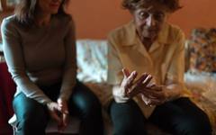 A family visiting a care home before deciding