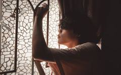 A person deep in thought, weighing a difficult family decision