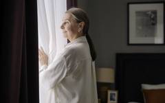 An elderly woman alone at home, where the first signs of needing help appear