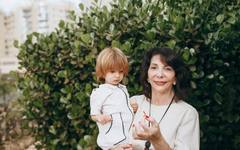 A grandmother walking with her grandchild